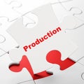 Business concept: Production on puzzle background