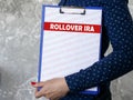 Business concept about ROLLOVER IRA with sign on the piece of paper Royalty Free Stock Photo