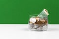 Business concept, saving planning with coins in glass jar