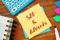 Business concept about SEO&AdWords with sign on the piece of paper