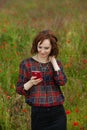 Business concept shot of a beautiful young woman sitting at a desk using a computer in a field. Royalty Free Stock Photo