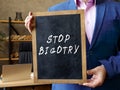 Business concept about STOP BIGOTRY with phrase on the chalkboard