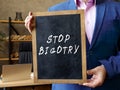 Business concept about STOP BIGOTRY with phrase on the chalkboard Royalty Free Stock Photo