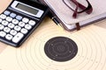 Target, calculator, pen, notebook, glasses - setting goals Royalty Free Stock Photo