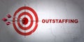Business concept: target and Outstaffing on wall background