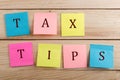 Business concept for taxpayer - Many colorful sticky note with text Tax tips