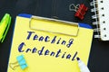 Business concept about Teaching Credential with phrase on the sheet