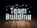 Business concept: Team Building in grunge dark room Royalty Free Stock Photo
