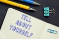 Business concept about TELL ABOUT YOURSELF with inscription on the piece of paper