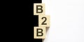Business concept text B2B on the wood block on the black and white background Royalty Free Stock Photo