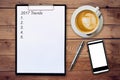 Business concept - Top view clipboard writing Trends 2017, pen,