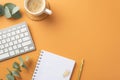 Business concept. Top view photo of workplace white keyboard organizer gold pen clips cup of coffee on rattan serving mat and Royalty Free Stock Photo