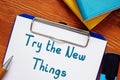 Business concept about Try The New Things with phrase on the piece of paper Royalty Free Stock Photo