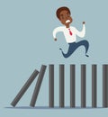 Business concept of a black african american businessman running on top of domino effect Royalty Free Stock Photo