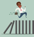 Business concept of a black african american businessman running on top of domino effect Royalty Free Stock Photo