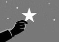 Businessman hand picking up a star