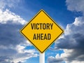 Business concept victory ahead road sign on blue cloudy sky Royalty Free Stock Photo