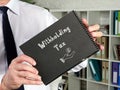 Business concept about Withholding Tax with inscription on the page