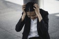 Young businesswoman holding her head with her hand Feeling desperate about financial problems termination Royalty Free Stock Photo