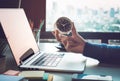 Business concepts with businessman holding clock on computer laptop.For investment analysis,Waiting to sucess Royalty Free Stock Photo