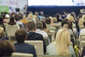 Business Concepts. Large Group of People at the Conference Watching Presentation Charts on Screen in Front of Them