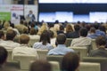 Business Concepts. Large Group of People at the Conference Watching Presentation Charts on Screen Royalty Free Stock Photo