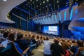 Business conference attendees sit and listen Royalty Free Stock Photo