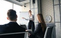 Business conference presentation with team training flipchart office. Royalty Free Stock Photo