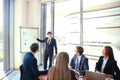 Business conference presentation with team training flipchart office. Royalty Free Stock Photo