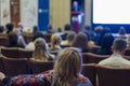 Business Conferences Concepts. Male Host Speakers Standing in Front on Stage