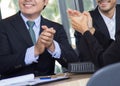 Business congratulation.asian business people team applauding in the meeting after finish project presentation Royalty Free Stock Photo