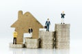 Business consultants on financial transactions for home loan, miniature people. Image use for financial, business concept