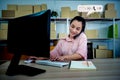 Business Contact Us concept, Asian Business woman  typing on computer keyboard , talking with customer with communication contact Royalty Free Stock Photo