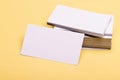 Business contacts concept. Business cards stack on yellow background. Name cards in white Royalty Free Stock Photo