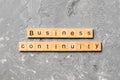 Business Continuity word written on wood block. Business Continuity text on cement table for your desing, concept Royalty Free Stock Photo