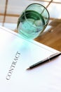 Business contract with pen is ready to sign. A glass of water Royalty Free Stock Photo