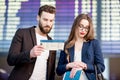 Business couple at the airport Royalty Free Stock Photo