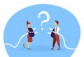 Business couple holding electrical plug teamwork confused man woman connection problem solution concept question mark Royalty Free Stock Photo