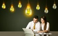 Business couple with idea bulbs