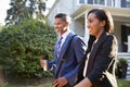 Business Couple Leaving Suburban House For Commute To Work Royalty Free Stock Photo