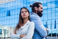 business couple of man and woman outdoor back to back, confrontation Royalty Free Stock Photo