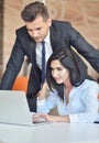 Business couple in an office working on the computer Royalty Free Stock Photo