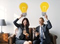 Business couple sitting together with icons Royalty Free Stock Photo