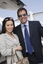 Business Couple Standing At Airfield Royalty Free Stock Photo