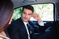 Business couple talking in car Royalty Free Stock Photo
