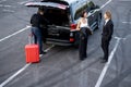 Business couple traveling by car with personal driver Royalty Free Stock Photo