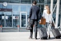 Business couple walking to the airport Royalty Free Stock Photo