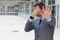 Business covering his eyes to avoid reality Royalty Free Stock Photo