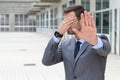 Business covering his eyes to avoid reality Royalty Free Stock Photo