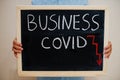 Business covid crisis. Coronavirus concept. Boy hold inscription on the board